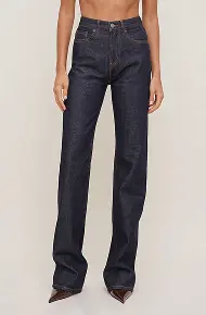 Model is wearing ultra high rise bootcut jeans.
